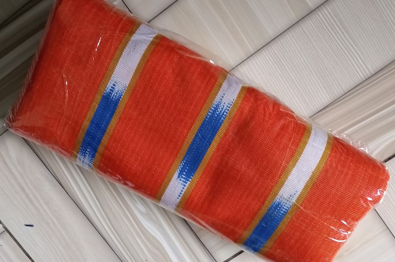 Ghanaian traditional cloth - Orange with white and peach stripes and design Ghanaian traditional cloth - Image 1